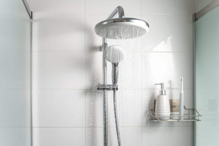 A shower head running conditioned water