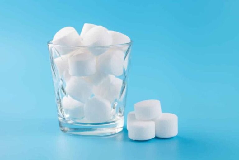 Water softener salt tablets in a glass