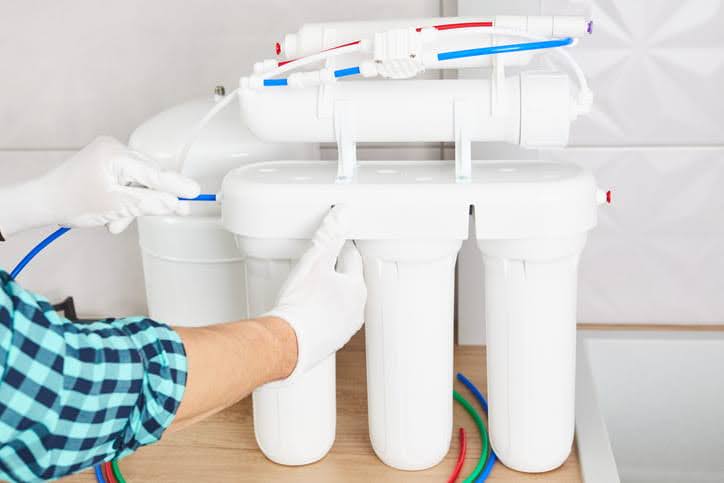 A Reverse Osmosis Water Filtration System Being Installed