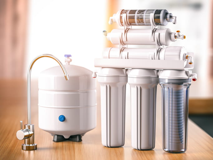 A reverse osmosis water purification system on a table.