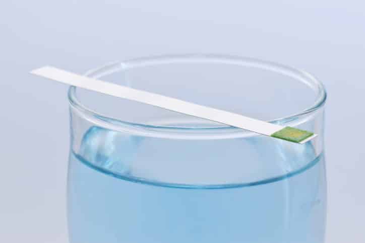 Testing the water hardness.